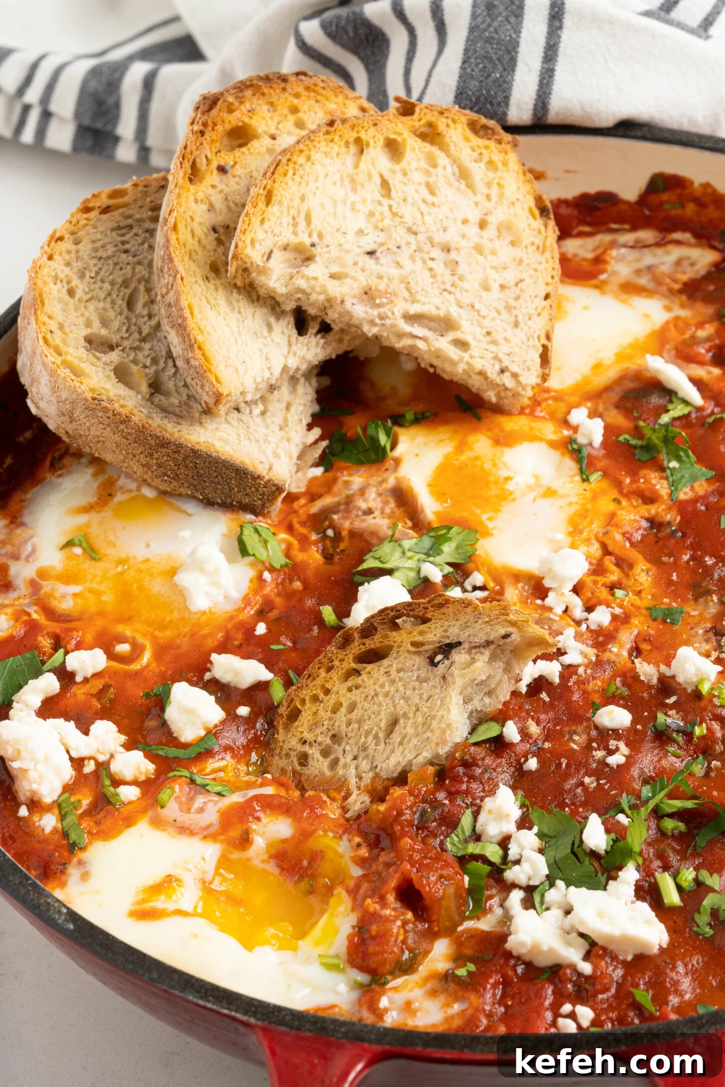shakshuka in a pan with bread