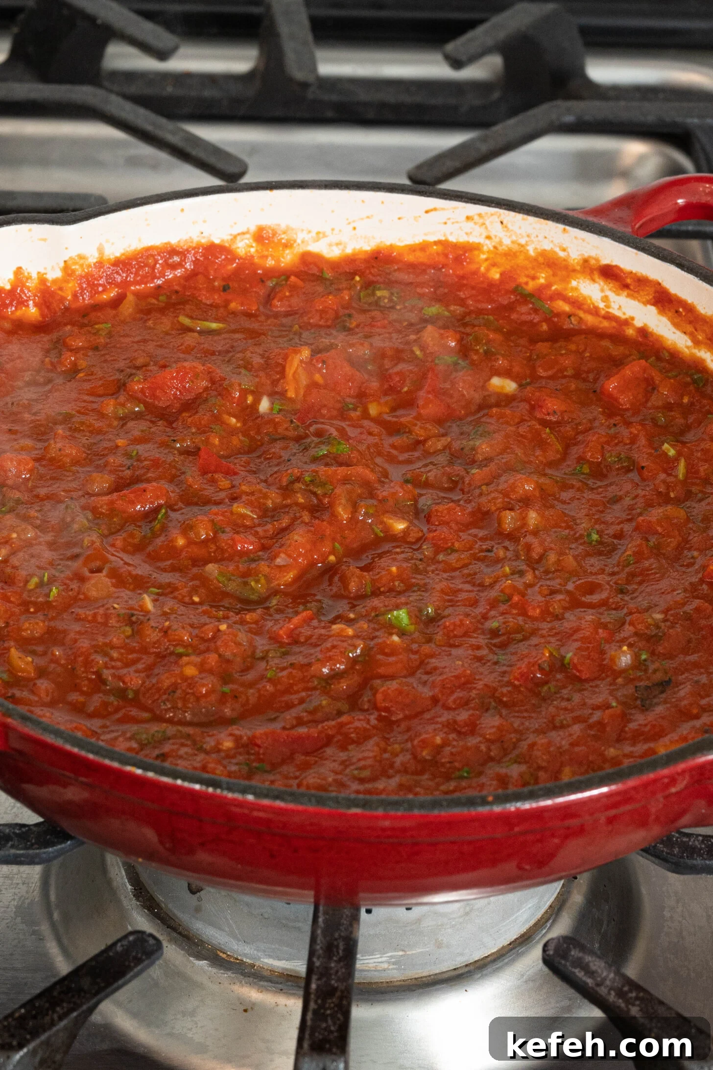 tomato sauce in a pan on a stovetop