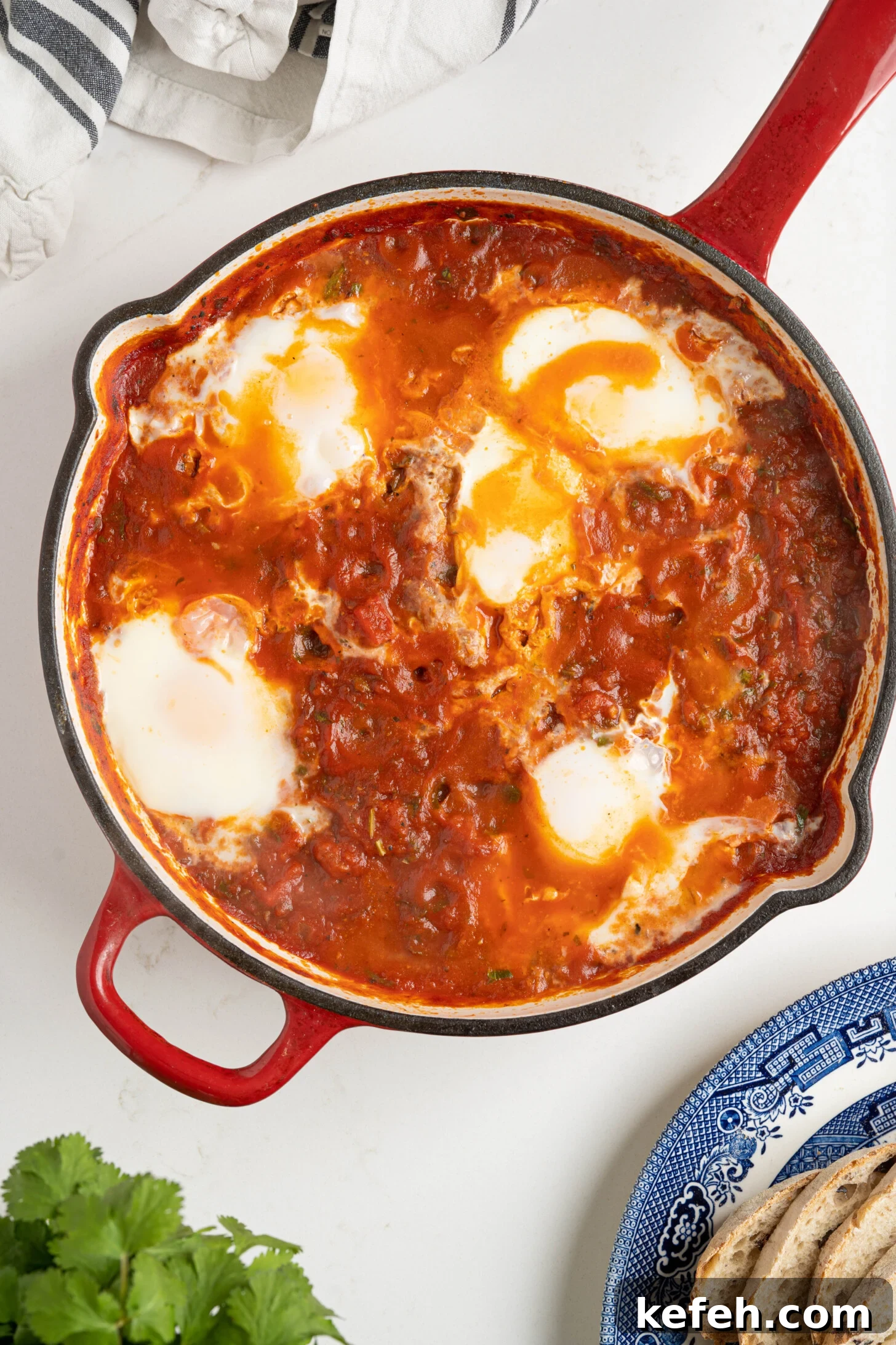 shakshuka in a pan on a white counter