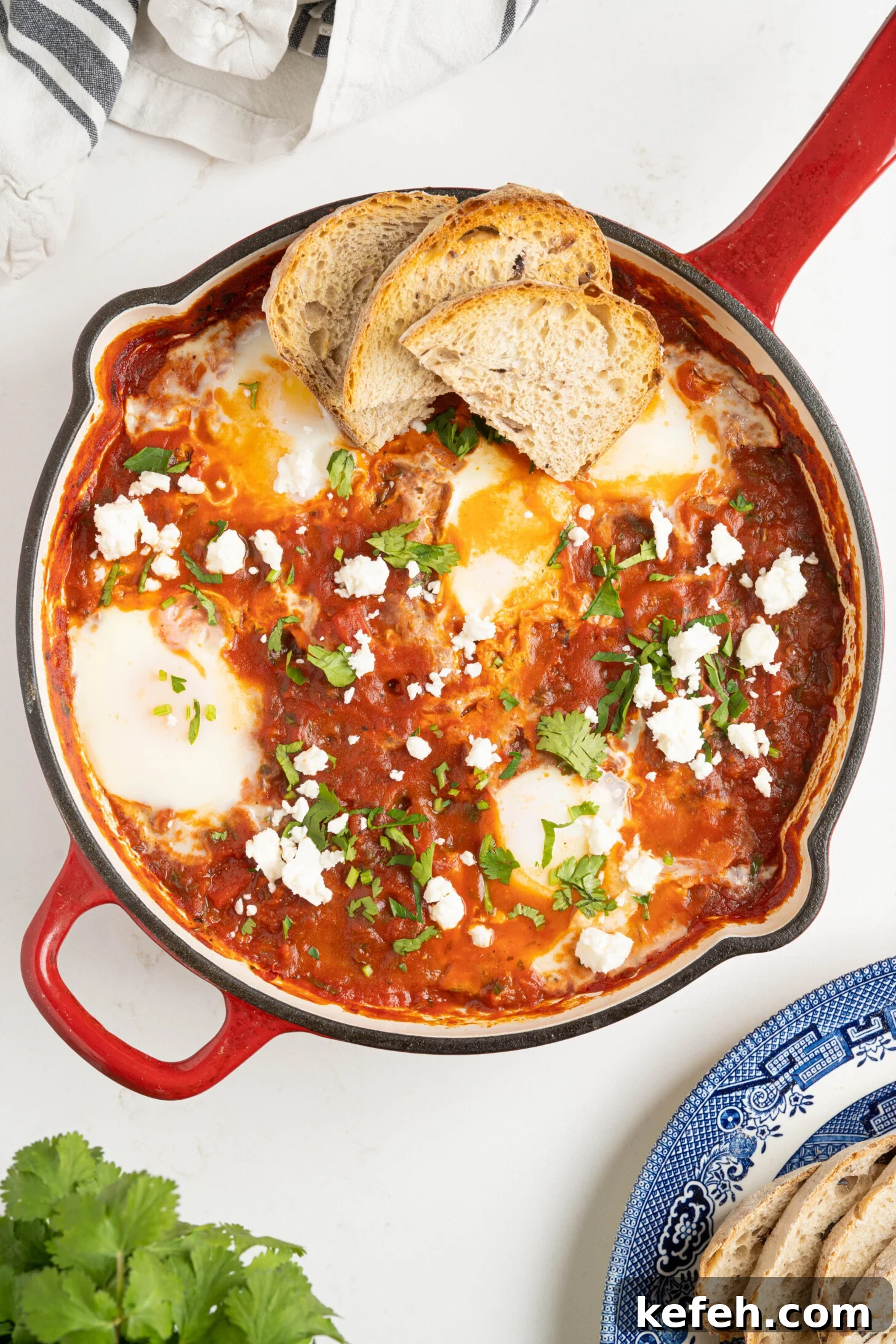 shakshuka in a pan on a white counter