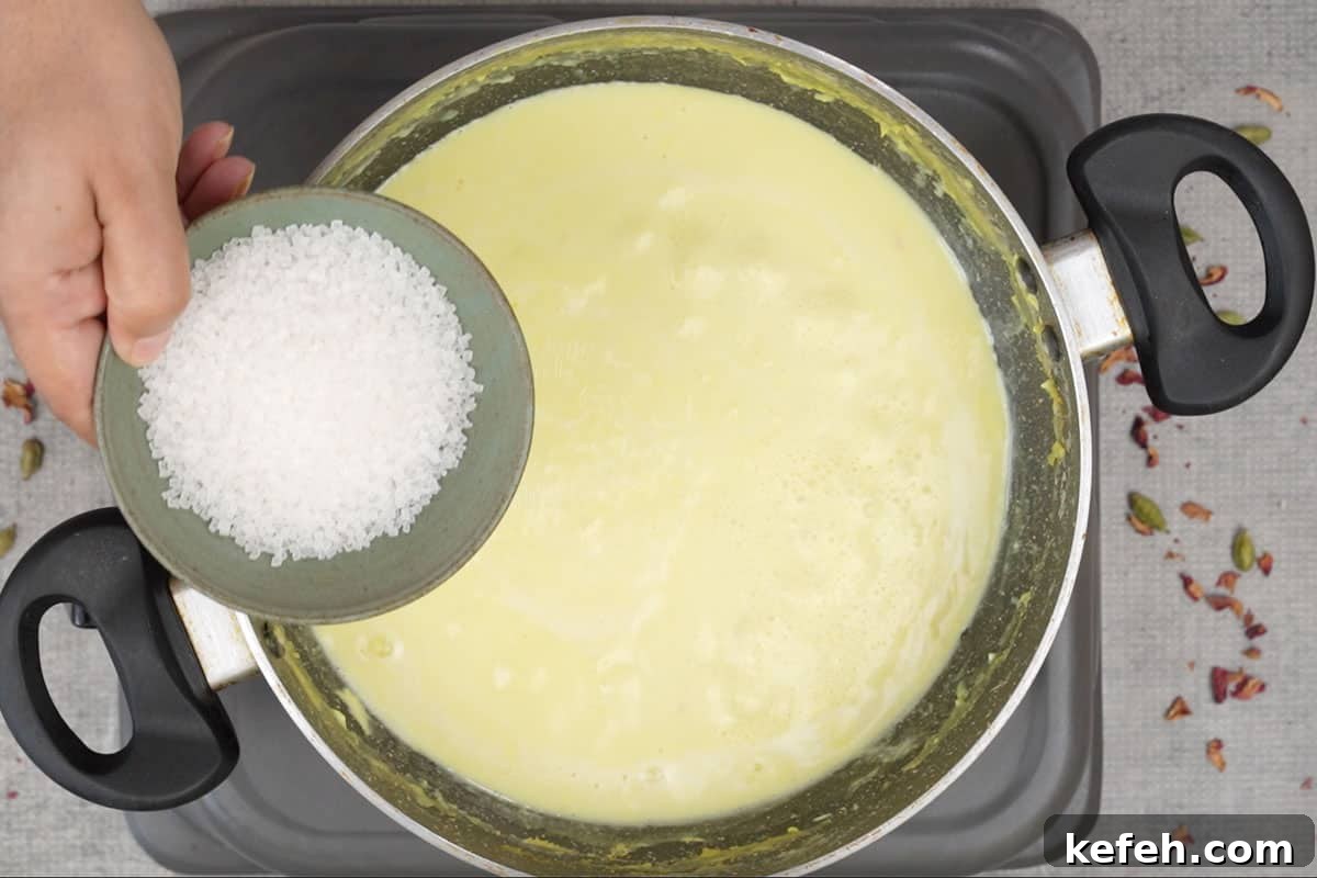 Adding sugar to reduced milk.