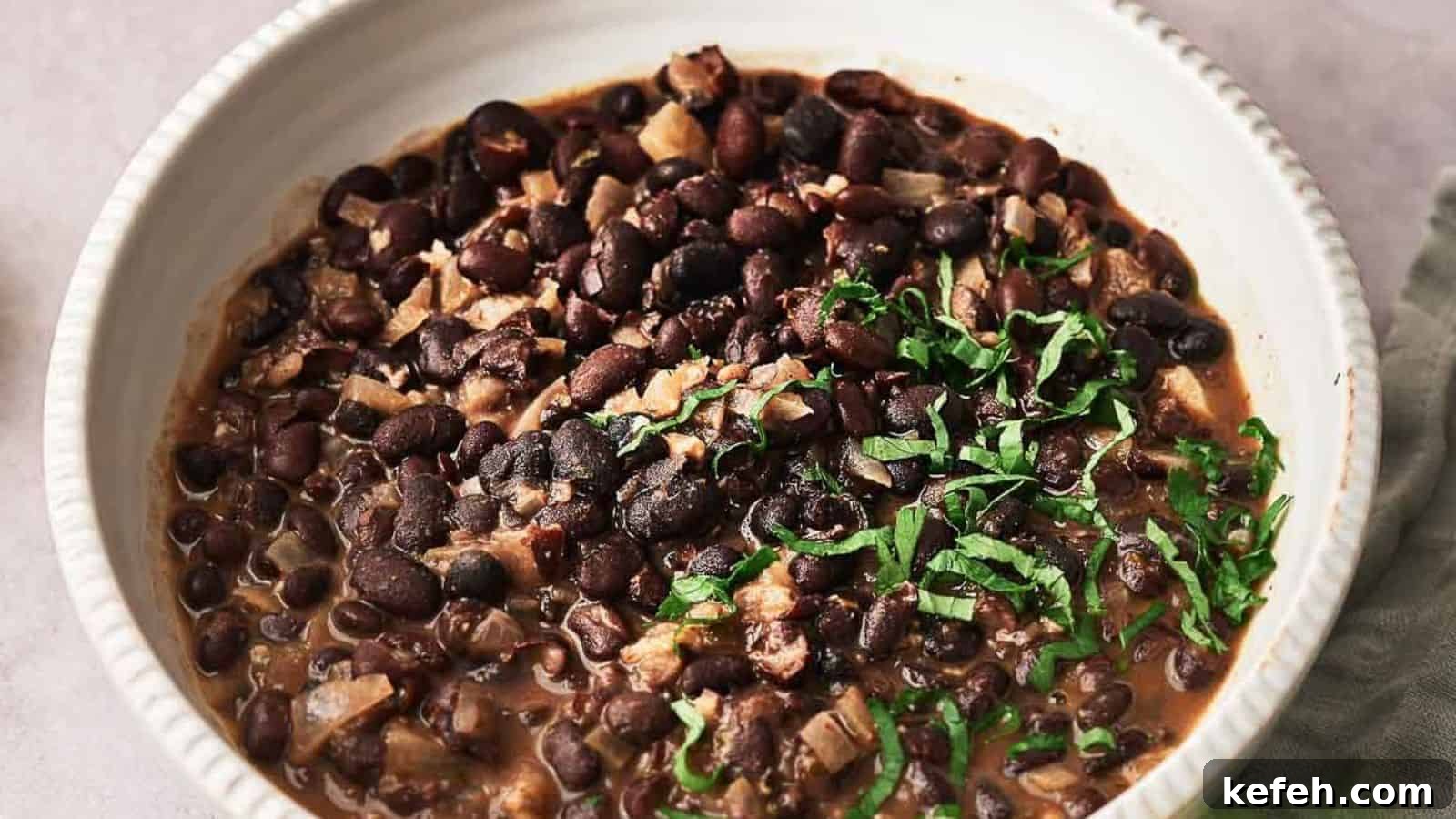 Chipotle black beans cooked and in a serving bowl.