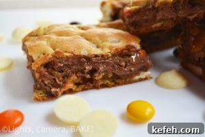 Halloween Candy Blondies Recipe with Leftover Treats (Video) 4 Leftover Halloween Candy Blondies. These are ooey gooey blondies packed full of different candies and confectionary. Perfect for leftover Halloween candy or just a chocolate lovers dream! #halloweenrecipe #leeftovercandyrecipe #candybarblondies