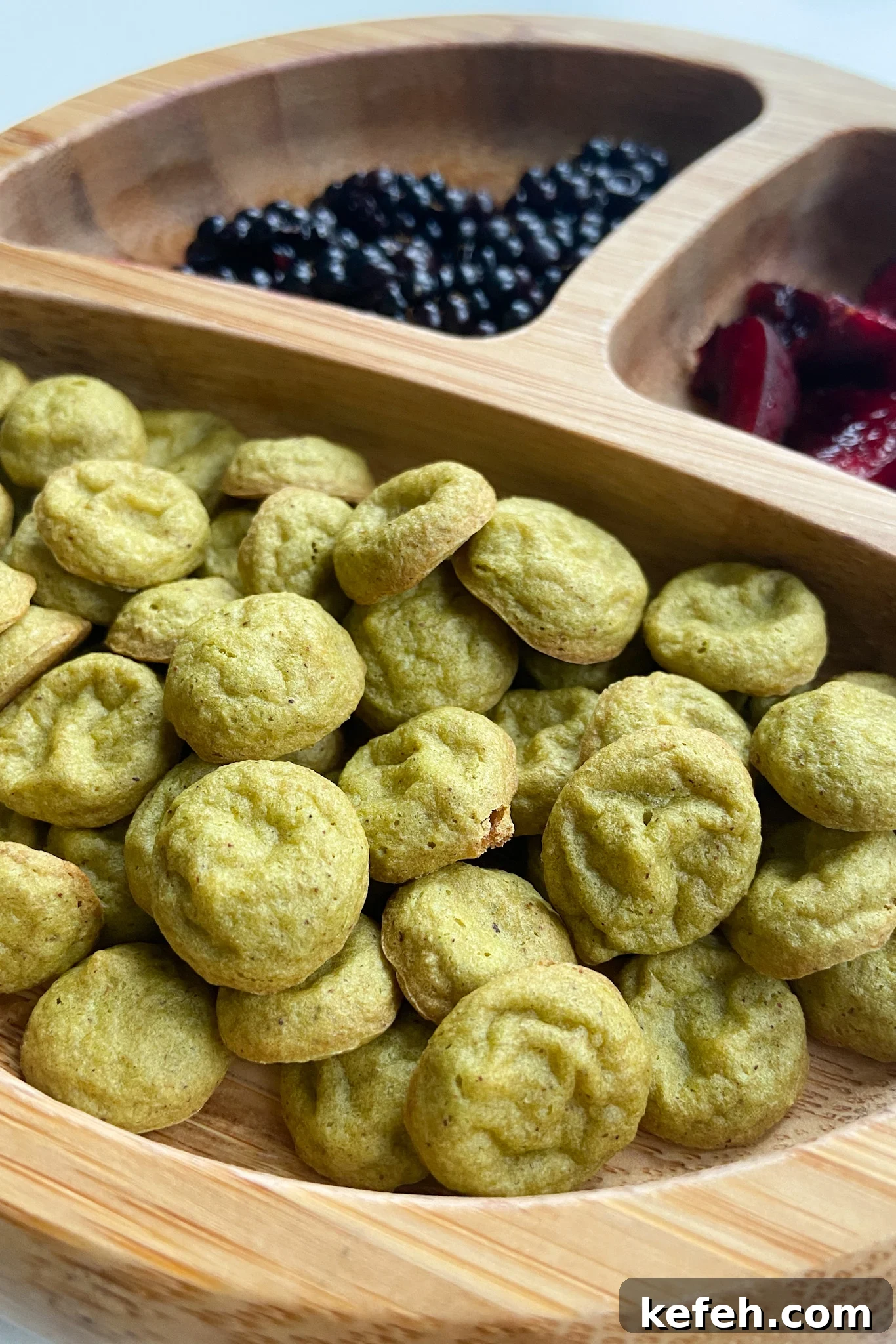 Spinach and Apple Baby Puffs — Homemade Toddler Snack Recipe 2 Spinach banana puffs served with blackberries and cherries