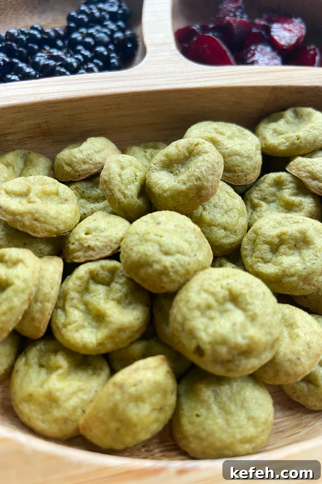 Spinach and Apple Baby Puffs — Homemade Toddler Snack Recipe 7 Spinach banana puffs served with blackberries and cherries