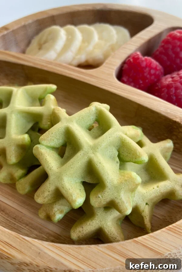 Spinach and Apple Baby Puffs — Homemade Toddler Snack Recipe 9 Spinach banana waffles served with sliced bananas and raspberries