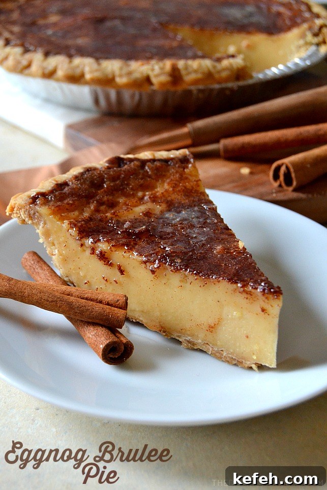 a slice of eggnog brulee pie on a white plate with cinnamon sticks