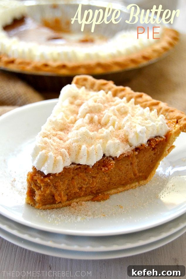 apple butter pie slice topped with whipped cream swirls on a stack of mini white plates