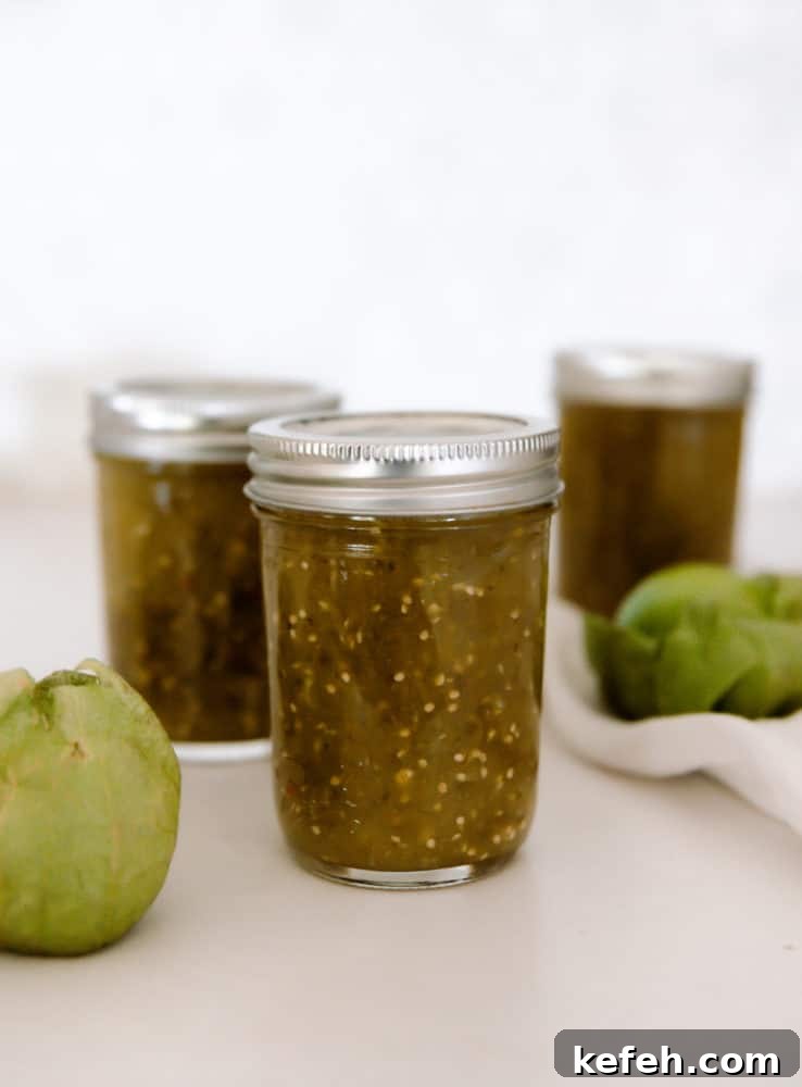 Canning jars filled with tomatillo salsa