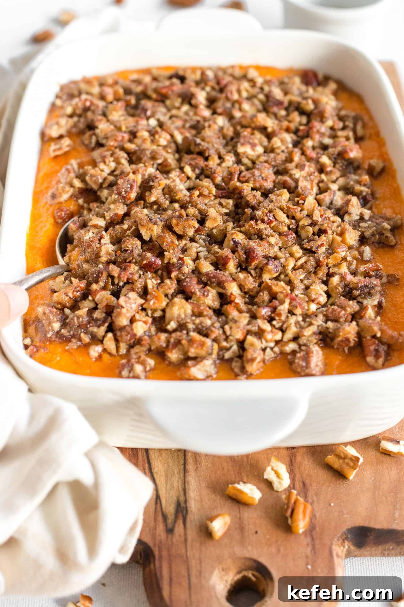 Gluten-Free Sweet Potato Casserole (Dairy-Free) Sweet potato casserole on a wooden board.