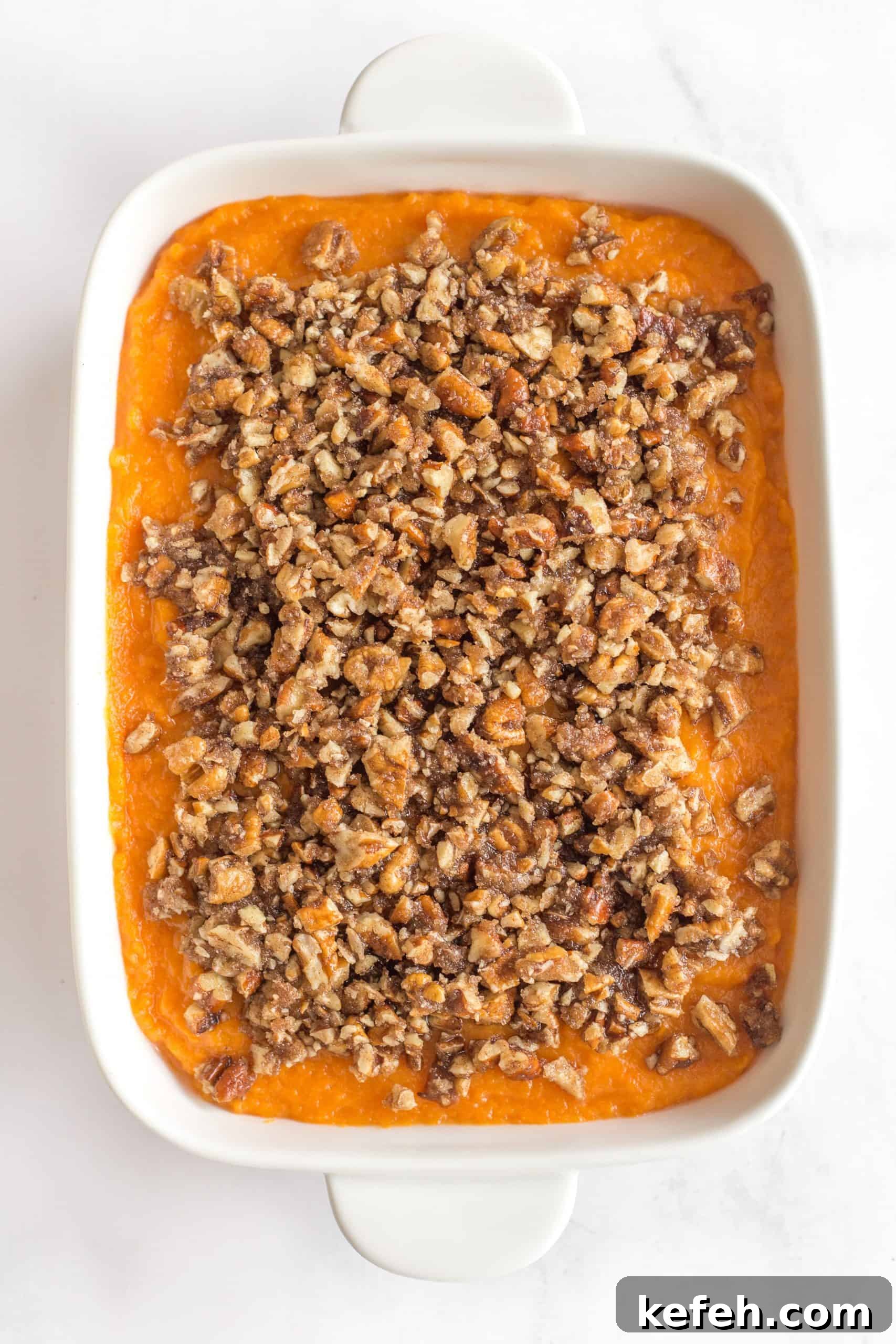 Gluten-Free Sweet Potato Casserole (Dairy-Free) Gluten-free sweet potato casserole on a marble board.