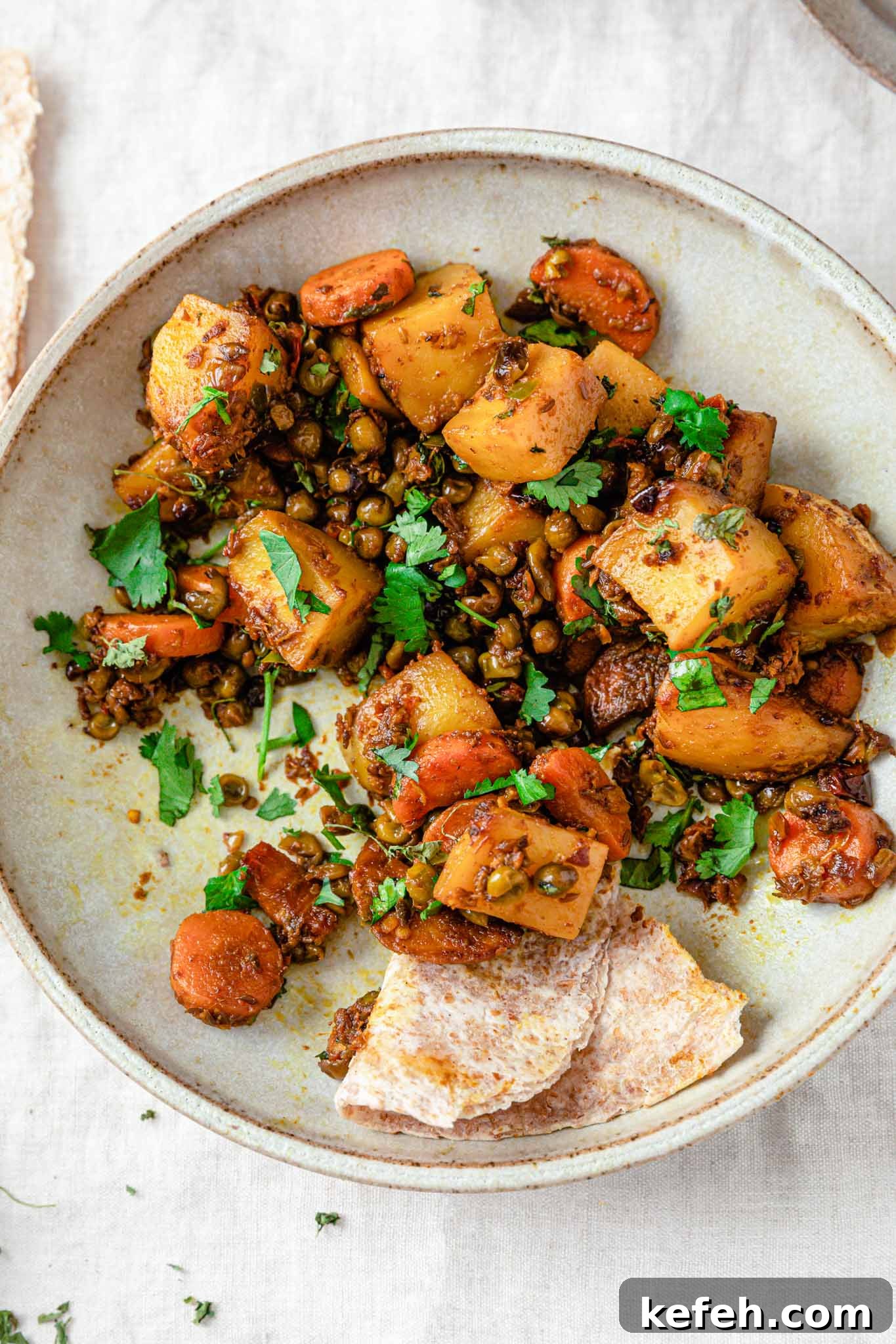 Mixed Vegetable Curry Recipe: Flavorful Indian Veggie Stew 8 Closeup of curried mixed vegetables inside a beige bowl