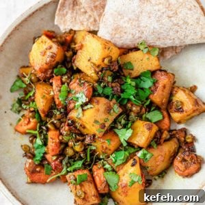Mixed Vegetable Curry Recipe: Flavorful Indian Veggie Stew 10 Mixed Vegetable Curry in a bowl with roti inside