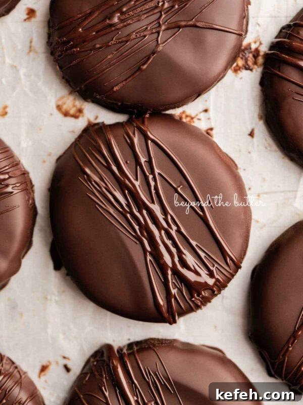 Creamy No-Bake Mint Chocolate Pie Recipe 6 Chocolate dipped thin mints on a wax paper lined baking sheet.