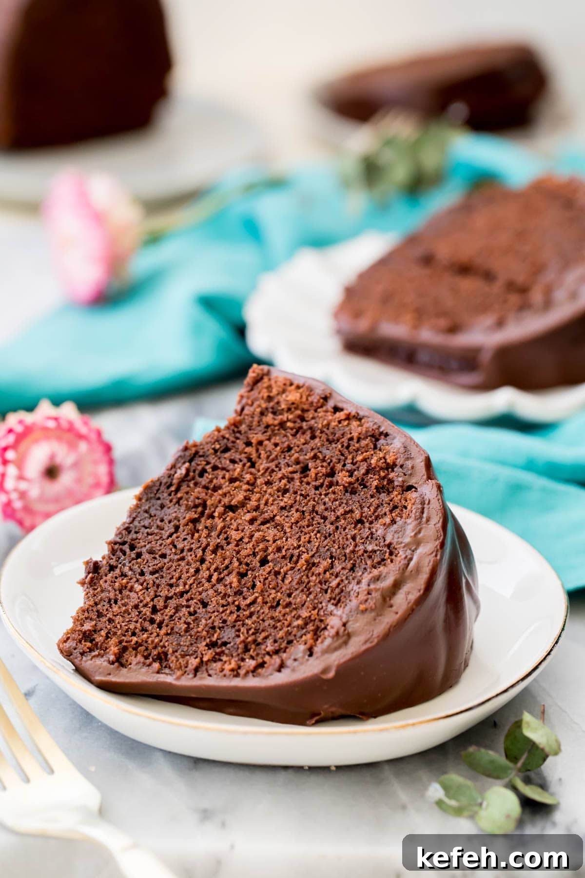 Moist Chocolate Bundt Cake Recipe (Video Tutorial) 6 Slice of chocolate bundt cake on white plate