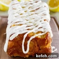 Loaf of Lemon Roll Pull Apart Bread with icing on top.