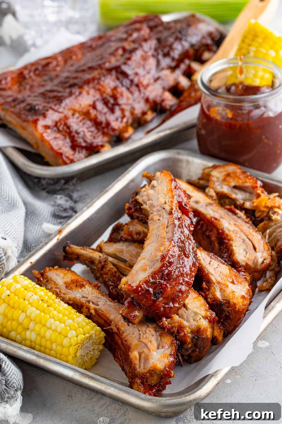 Ribs on metal platter with corn
