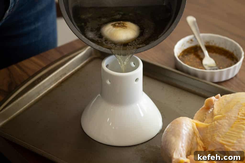 Boiled beer pouring into a beer can chicken roaster.