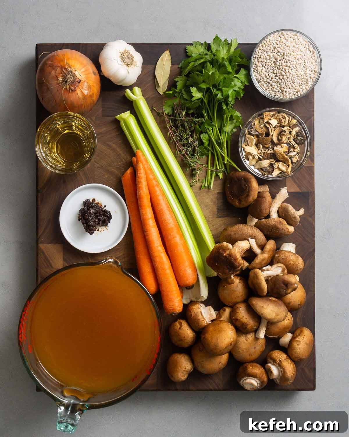 Ingredients shown, onion, garlic, herbs, barley, dry mushrooms, wine, miso paste, celery, carrots, mushrooms, and vegetable stock.