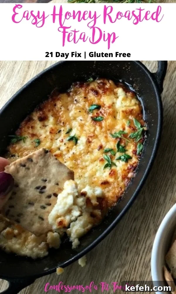 Honey-Roasted Feta Dip with Warm Honey and Crispy Herbs 5 Close up photo of a cracker dipped in feta with black and pink text on a white rectangle. Text says, Easy Honey Roasted Feta Dip | 21 Day Fix | Gluten free | Confessions of a Fit Foodie