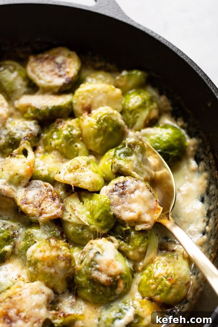 Creamy Brussels Sprouts Gratin with Parmesan and Garlic 2 close-up spoonful of brussels sprouts au gratin