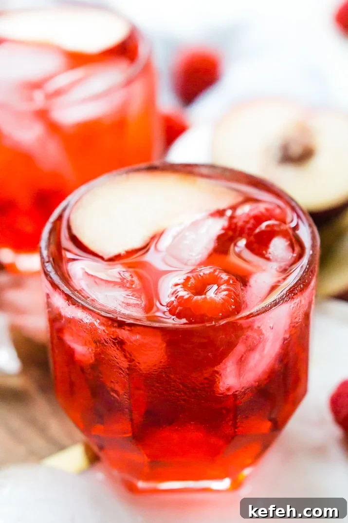 A Red Russian Cocktail is made with equal parts cherry liqueur and vodka over ice. Serve it in a punch bowl for parties or in short glasses for individual cocktails.