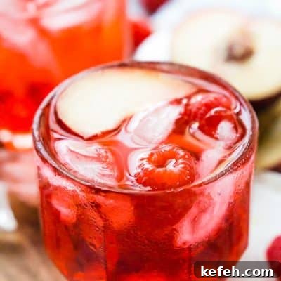 A Red Russian Cocktail is made with equal parts cherry liqueur and vodka over ice.