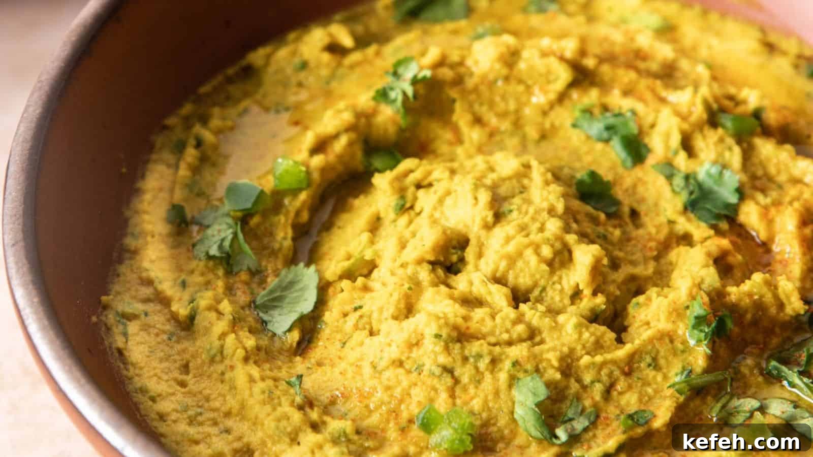 Zesty Spicy Chickpea Dip Recipe for Parties and Snacks 7 A close up image of spicy chickpea dip in a bowl.