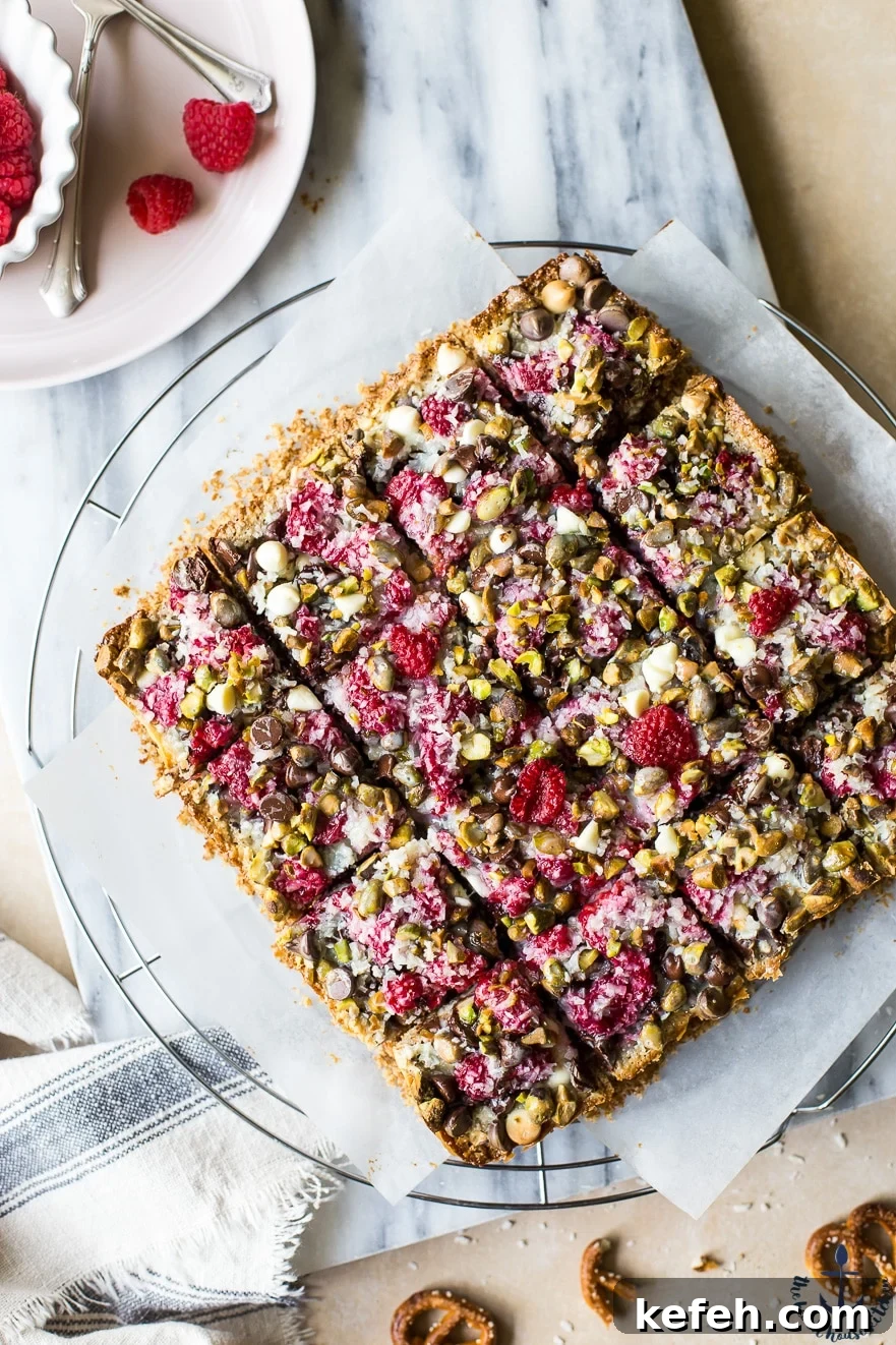 Overhead photo of Raspberry Pistachio Magic bars cut into squares