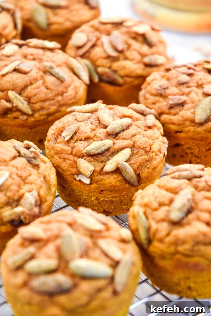 pumpkin spice pancake mix muffins on a cooling rack.