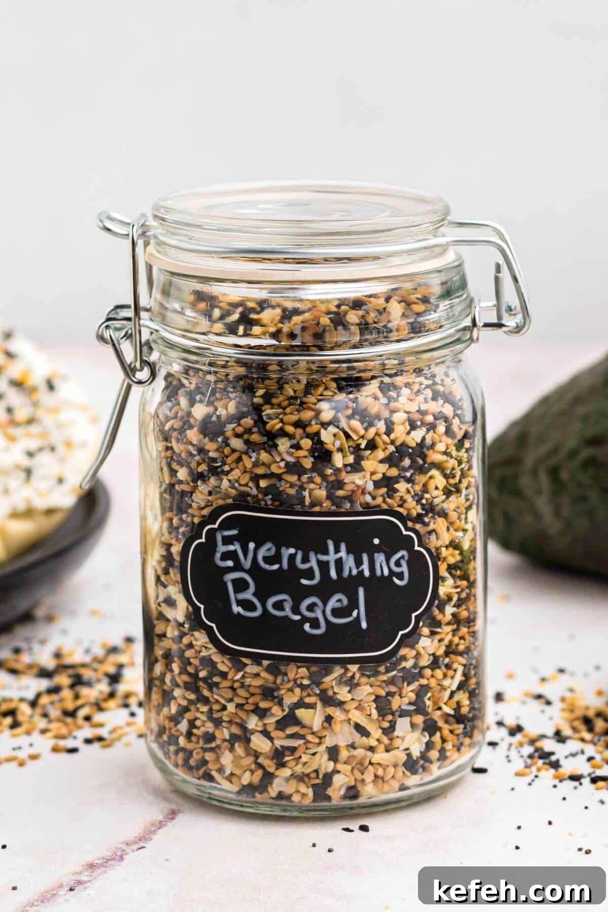 Small jar with a sealable lid filled with everything bagel seasoning.