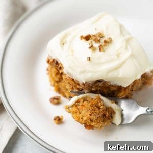 carrot cake on white plate with fork