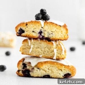 blueberry scones stacked on top of each other on a countertop