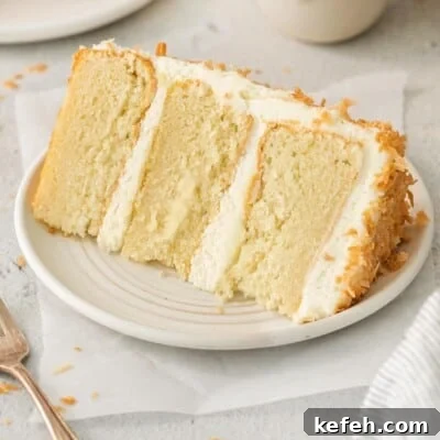 A slice of coconut cake on a plate