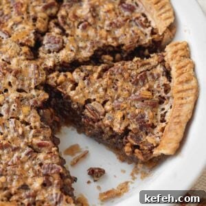 close up picture of gluten-free pecan pie in white serving dish