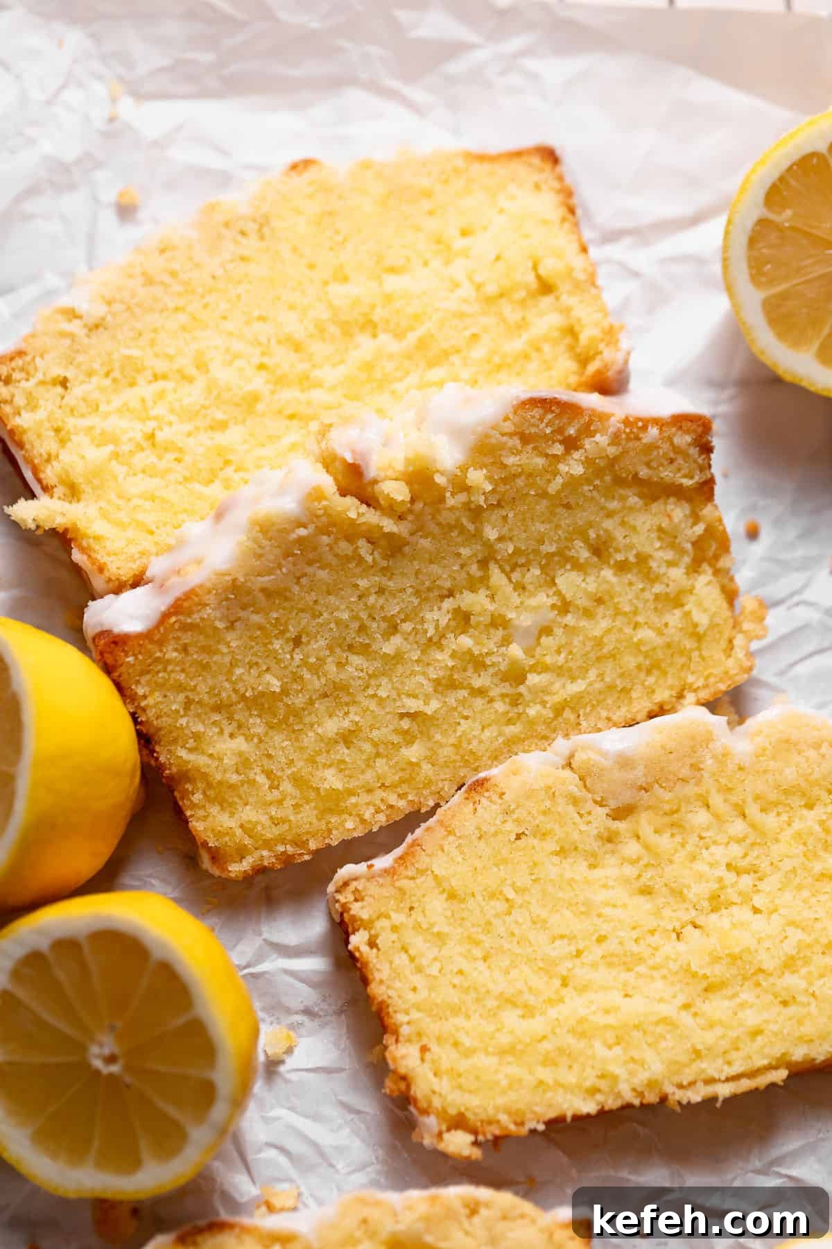 Lemon cake slices on white parchment paper.