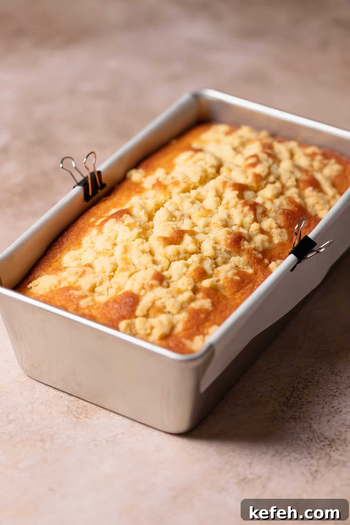 Lemon cake in a loaf pan after cooling.