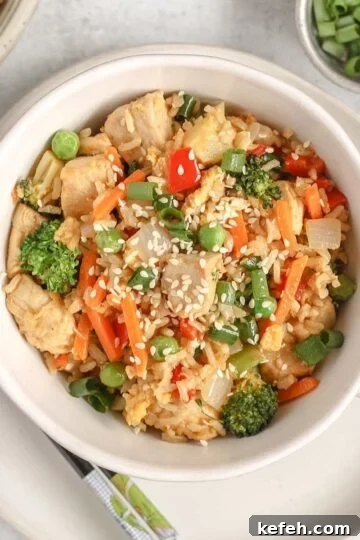 Chicken fried rice with lots of veggies in a single serve dish.