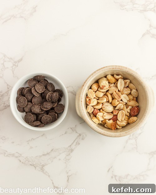 Peanuts and chocolate chip garnish for making keto payday bars.