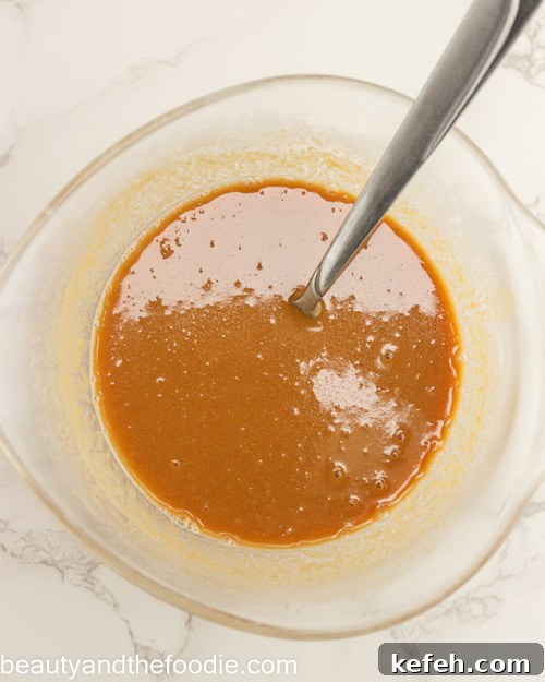 Mixing the caramel for making payday bars.