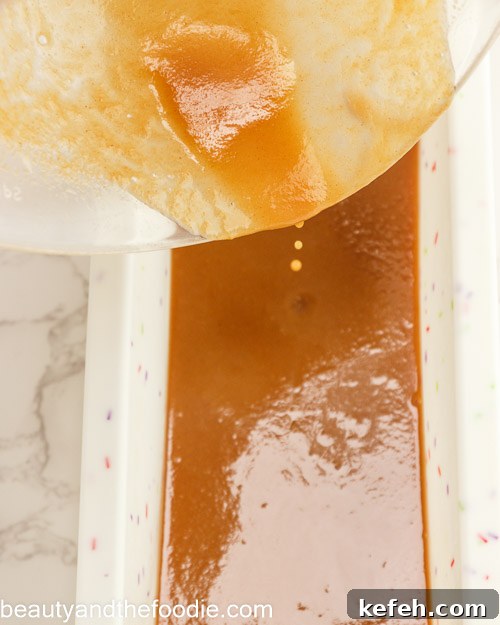 Pouring the caramel into a loaf pan.