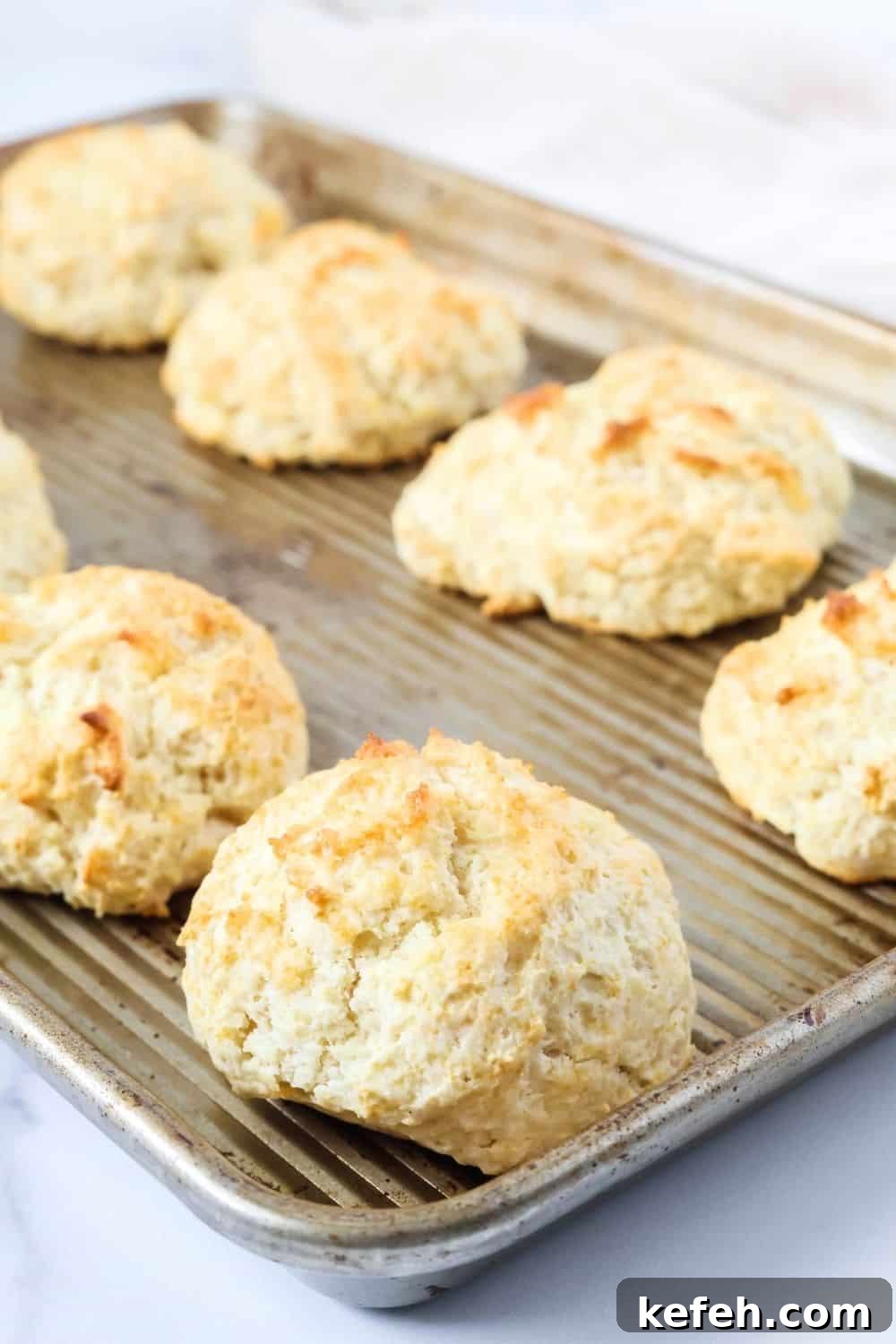 a baking sheet of freshly baked shortcut drop biscuits.