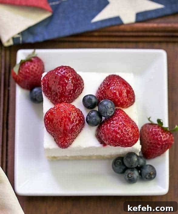 Berry Cheesecake Flag Dessert slice on a white square plate.
