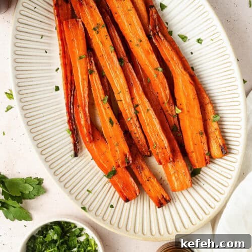 Maple glazed carrots served on a large ceramic platter.