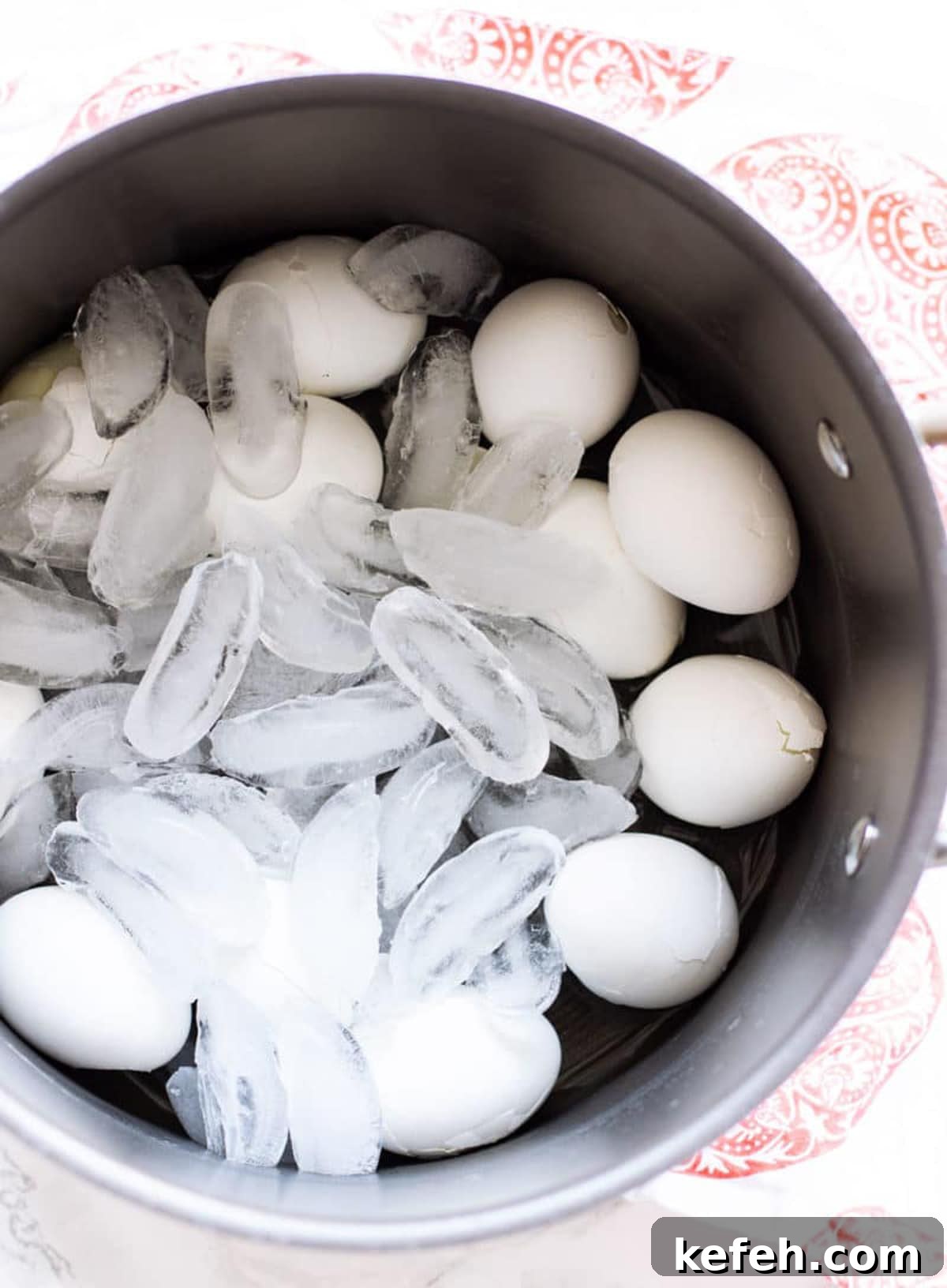 12 boiled eggs in an ice bath.