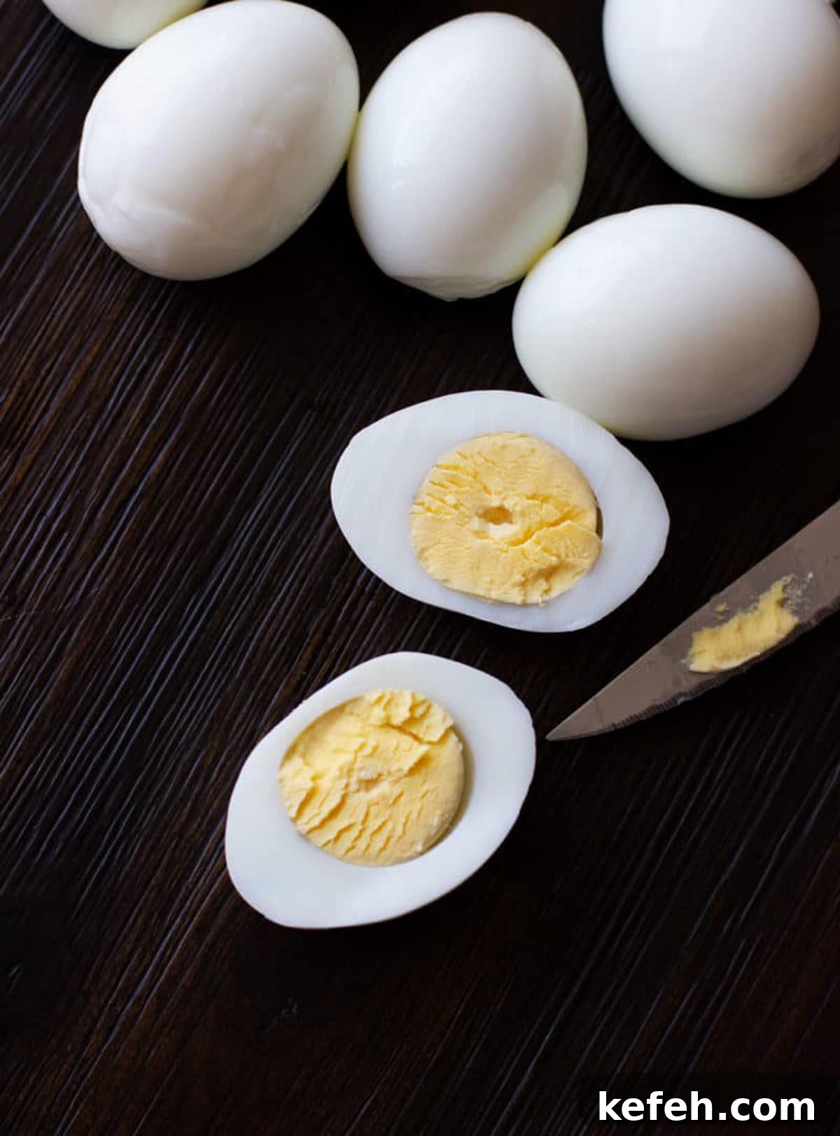 Sliced hard boiled egg on table.