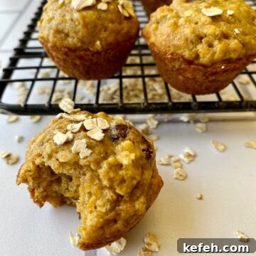 Carrot Banana Muffins with Cinnamon and Honey 16 Banana carrot muffins with oats on a cooling rack.