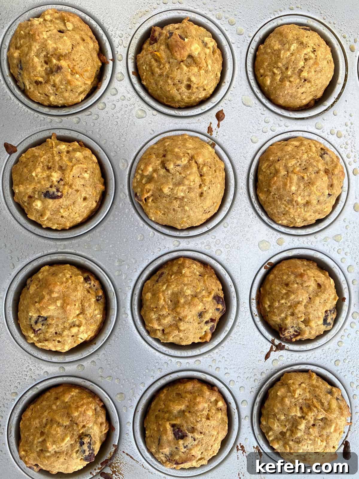 Carrot Banana Muffins with Cinnamon and Honey 10 Twelve mini muffins, baked and in a muffin pan.