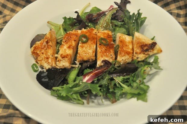 Ginger Sesame Salad Dressing - The Grateful Girl Cooks! A main dish chicken salad in a bowl, topped with ginger sesame salad dressing.
