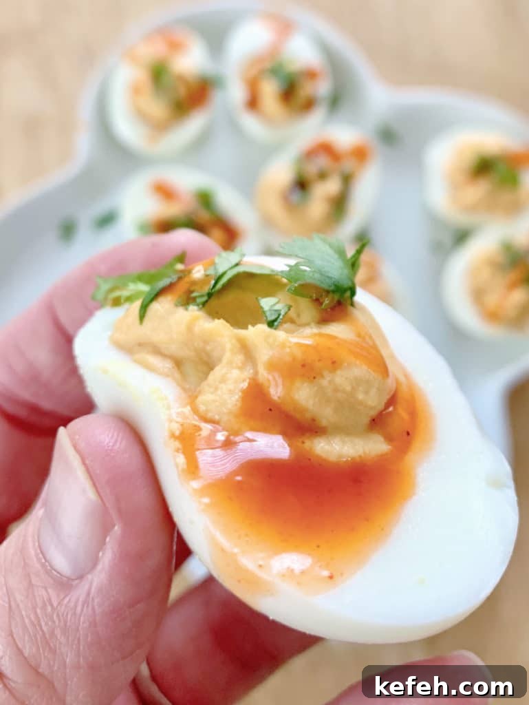 buffalo deviled egg in hand